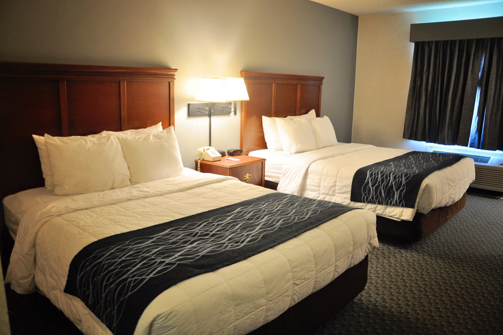Our Standard room features 2 queen size beds with 4 comfy pillows on each bed, 2 firm and 2 soft so you can pick your favorite!